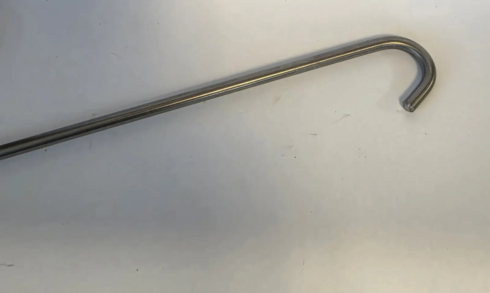 Close-up of the bent stainless-steel hook on the Go-Fer Stick