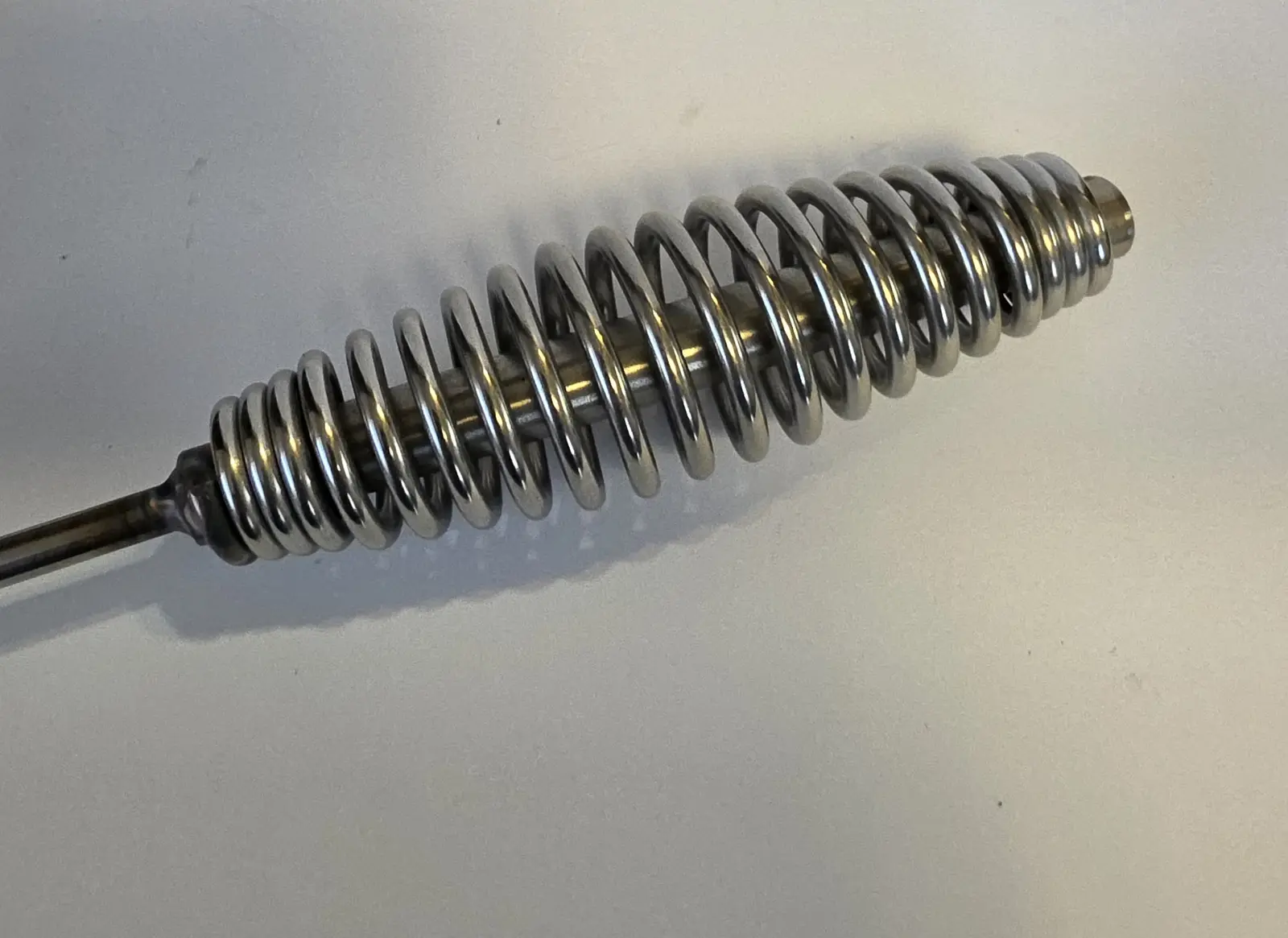 Close-up of the Go-Fer Stick spring-style stainless-steel handle