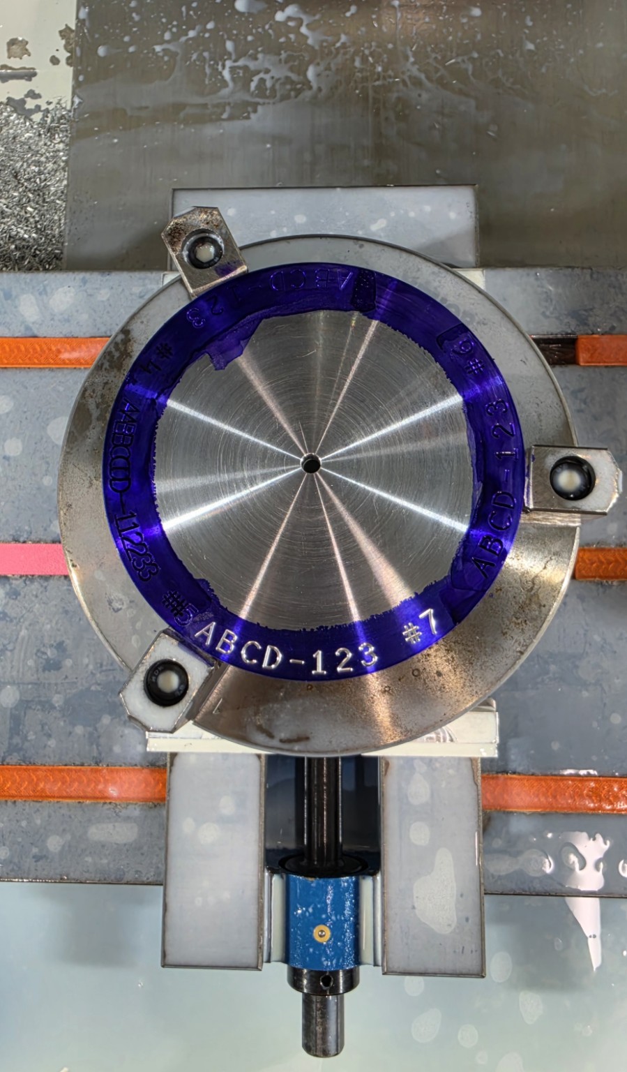 Machine-proven G47 circular engraving on a round test plate