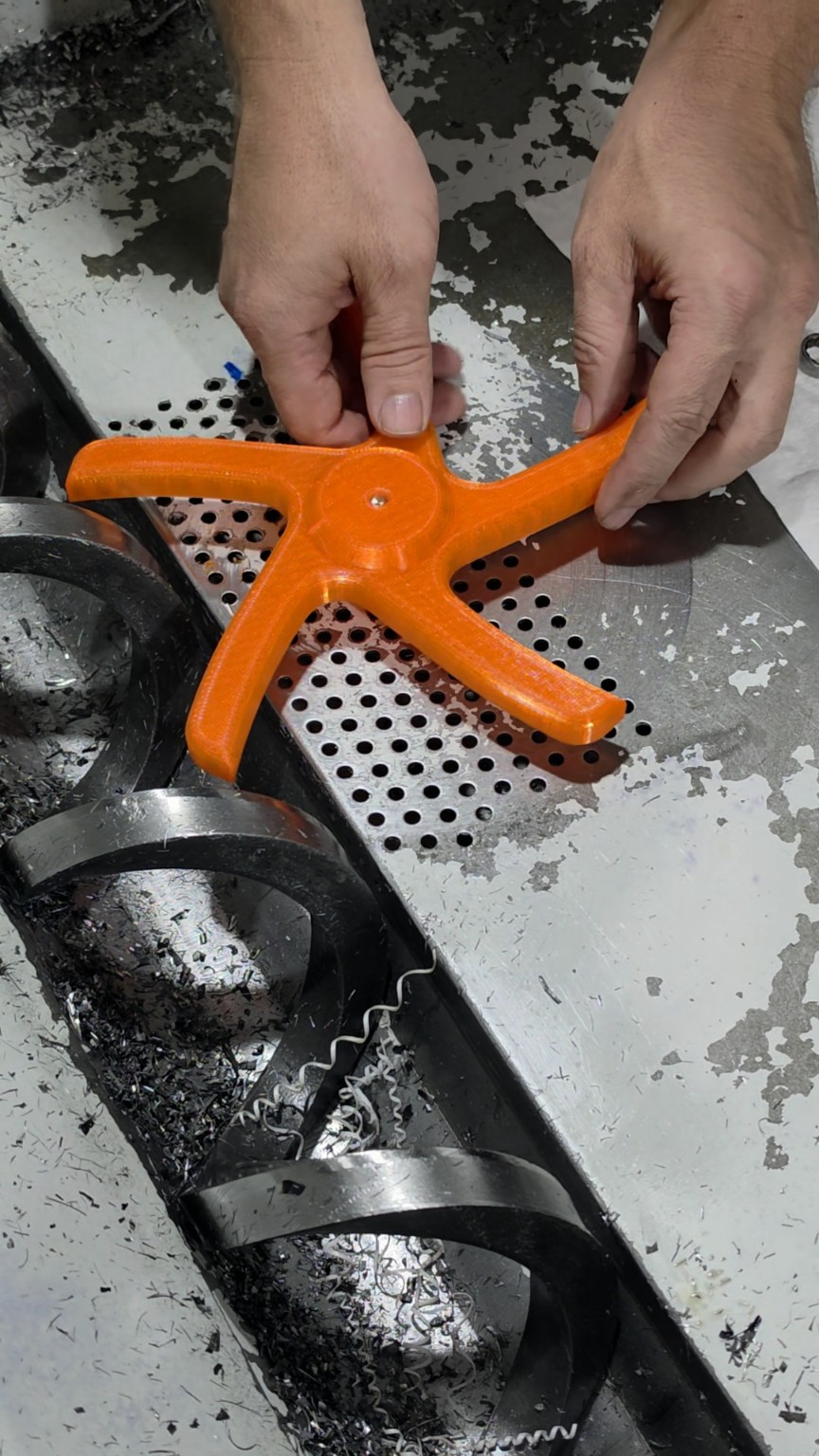 Chip Screen Spider placed on the installed axle with its flat side toward the chip pan