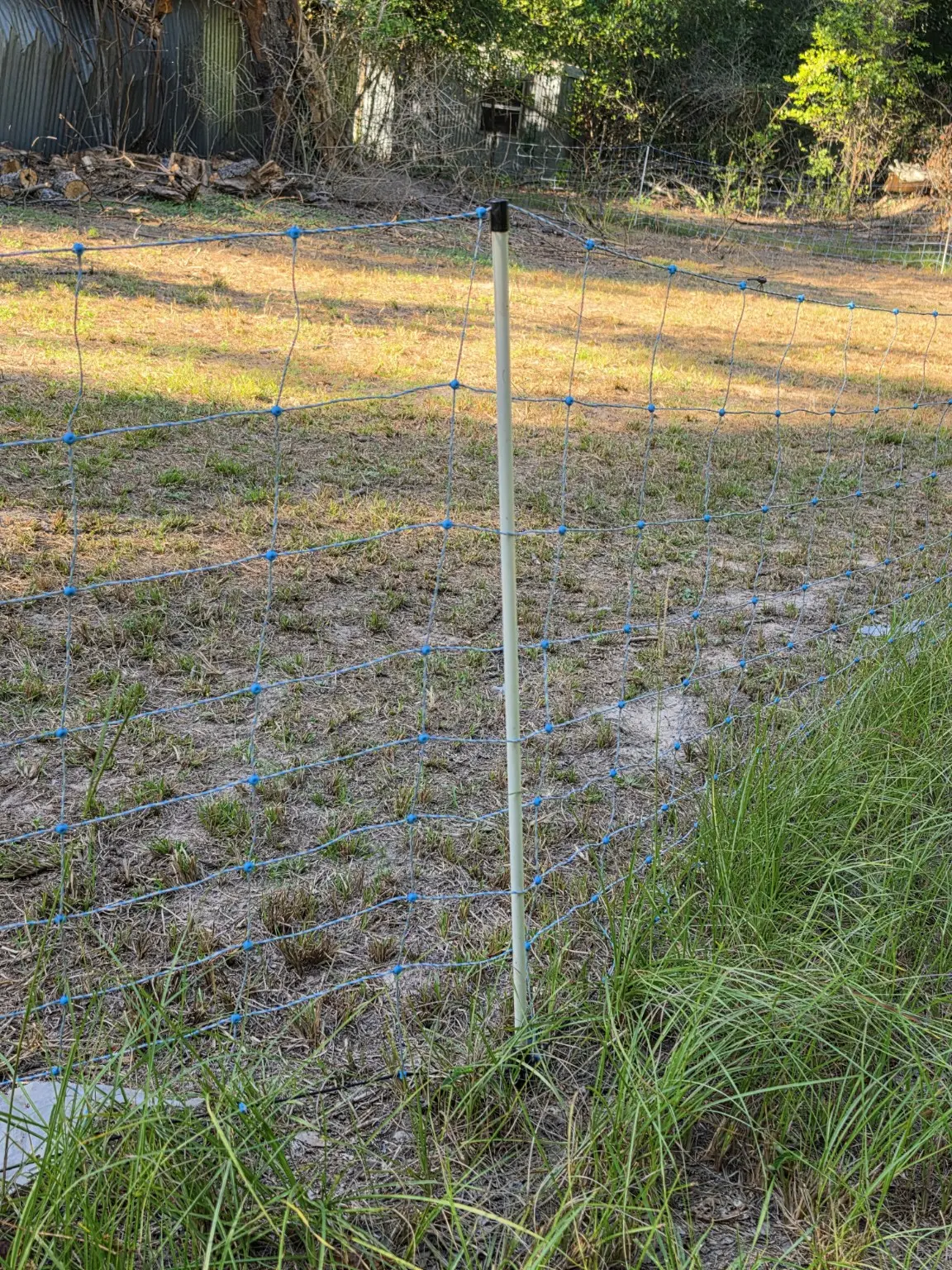Starkline replacement post installed in the 35-inch electric fence netting