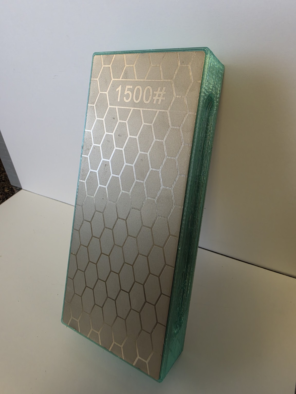 Cousin Louie translucent light-green sharpener with permanently installed 1500 grit plate
