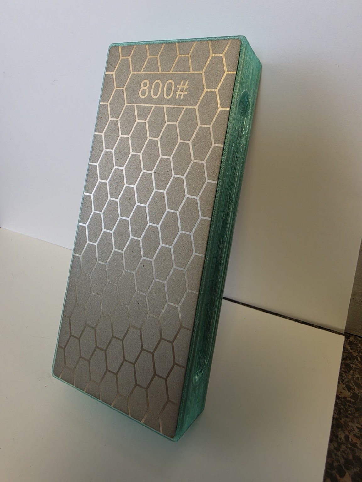 Cousin Louie translucent light-green sharpener with installed 800 grit plate