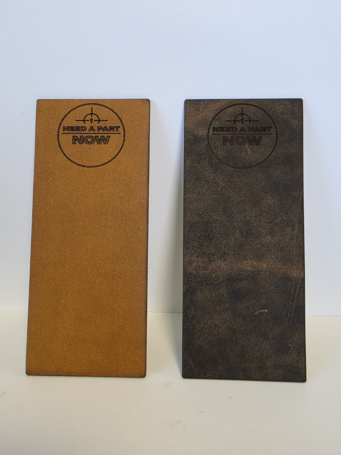 Light-brown and dark-brown buffalo-hide strop options