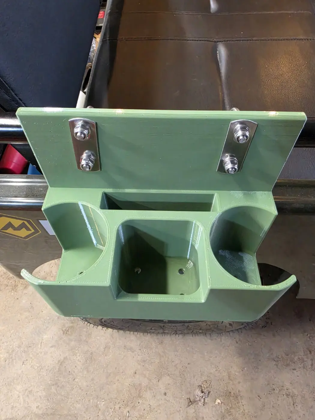 Empty mini Jeep organizer showing both drink holders, phone slot and open storage compartment