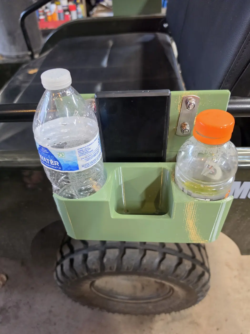 Front view of the mini Jeep organizer holding two drink bottles and a phone