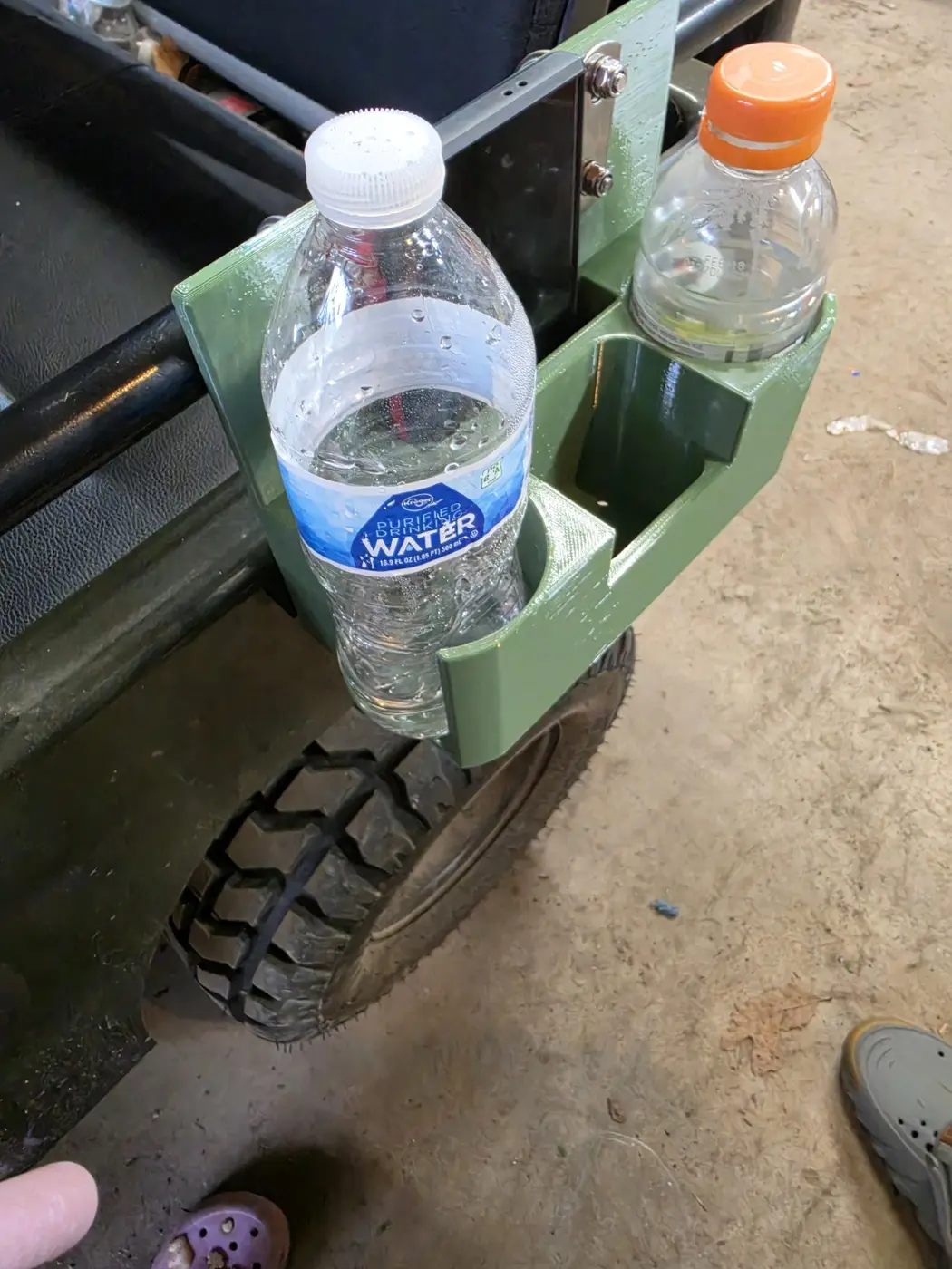 Side view of the mini Jeep organizer with a water bottle and sports drink